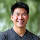 Coach David Chen, a fitness expert, demonstrating a safe exercise.